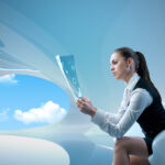 Sexy businesswoman examining future digital report / newspaper